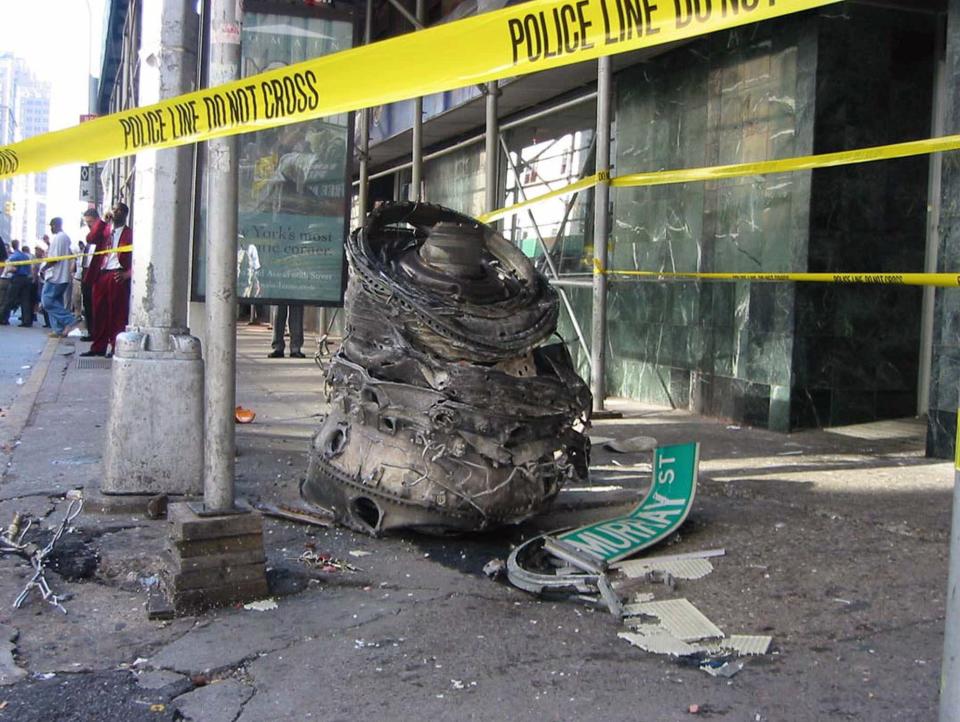 <p>A piece of debris, possibly from one of the crashed airliners, lies on the corner of Murray Street in lower Manhattan near the World Trade Center site on Sept. 11, 2001. (Photo: Chris Kline/AP) </p>