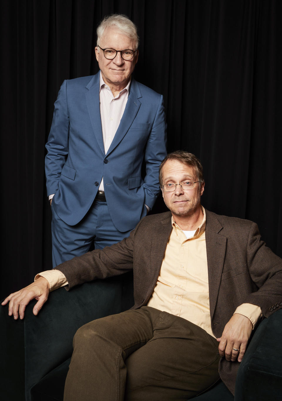 Harry Bliss, seated, and Steve Martin pose for a portrait to promote the book "Number One Is Walking: My Life in the Movies and Other Diversions" on Thursday, Nov. 3, 2022, in New York. (Photo by Matt Licari/Invision/AP)