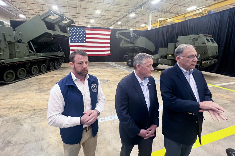 Sen. Markwayne Mullin, R-Ok., left, Rep. Bruce Westerman, R-Ark., center and Sen. John Bozeman, R-Ark., talk to reporters in front of M270 MLRS and HIMARS launcher systems that are produced by Lockheed Martin's Camden, Ark., plant, Thursday, March 14, 2024. Both weapons are highly coveted in Ukraine as it defends itself against Russia. On Thursday all three lawmakers expressed optimism that the Ukraine supplemental bill will find a way to passage and highlighted the impact it will have on their local workforces. (AP Photo/Tara Copp)