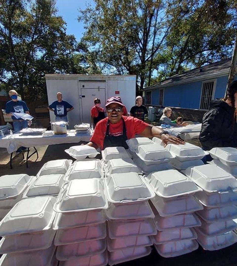 Pastor Silvia Tisdale, founder of the Epps Christian Center in Pensacola, smiles Nov. 20 as she hands out meals to those in need.