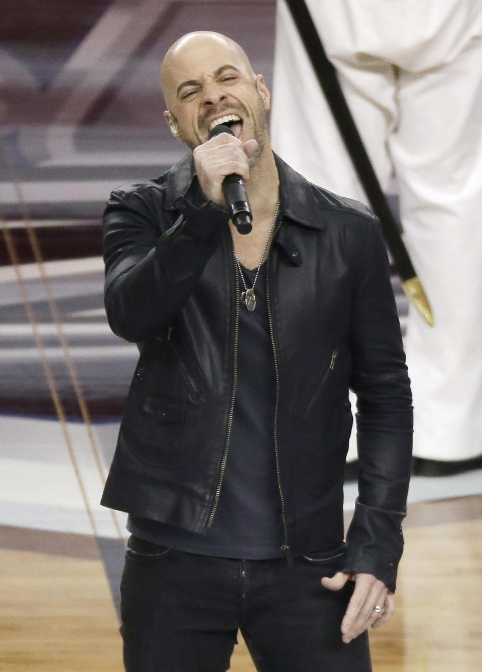 Chris Daughtry sings the national anthem before an NCAA Final Four tournament college basketball semifinal game between Florida and Connecticut, Saturday, April 5, 2014, in Arlington, Texas. (AP Photo/Tony Gutierrez)