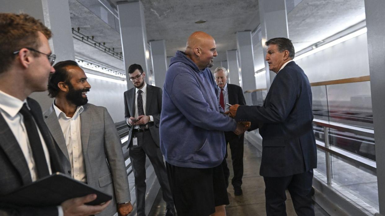 washington, dc june 22 sen john fetterman d pa has a quick exchange with sen joe manchin d wva, right, as fetterman walks to a vote on the senate floor on june 22, 2023 in washington, dc photo by ricky cariotithe washington post via getty images