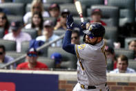 Milwaukee Brewers' Rowdy Tellez (11) strikes out against Atlanta Braves starting pitcher Ian Anderson during the fourth inning of Game 3 of a baseball National League Division Series, Monday, Oct. 11, 2021, in Atlanta. (AP Photo/Brynn Anderson)
