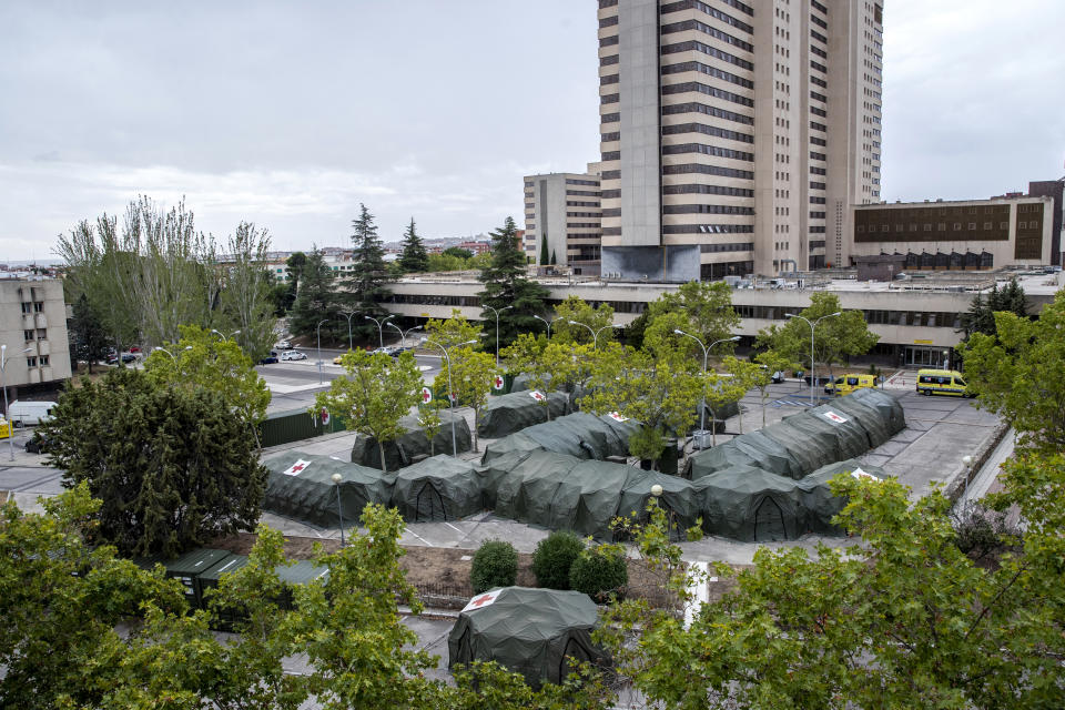 Spanish military tents are set out to be used by hospital patients during the coronavirus outbreak at the Gomez Ulla military hospital in Madrid, Spain, Friday, Sept. 18, 2020. A line of green tents have been installed at the gates of a Madrid military hospital four months after similar structures for triaging incoming patients and lighten up crammed emergency wards were taken down. (AP Photo/Manu Fernandez)