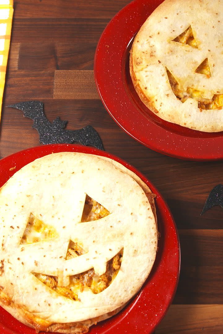 <p>This spooky dish is a trick and a treat.</p><p>Get the <a href="https://www.delish.com/uk/cooking/a33978422/jack-o-lantern-quesadillas-recipe/" rel="nofollow noopener" target="_blank" data-ylk="slk:Jack O' Lantern Quesadillas;elm:context_link;itc:0;sec:content-canvas" class="link ">Jack O' Lantern Quesadillas</a> recipe.</p>