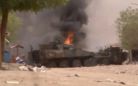 An armoured personnel carrier on fire after a car bomb attack in Gao, northern Mali July 1, 2018. - Credit: REUTERS TV/REUTERS