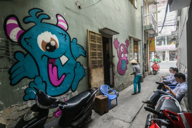 Illicit spray-painting is a way of defying restrictions in uthoritarian Vietnam where artists must have their work approved before exhibitions, shows are routinely shut down, and works deemed controversial are replaced by a black 'X' on gallery walls