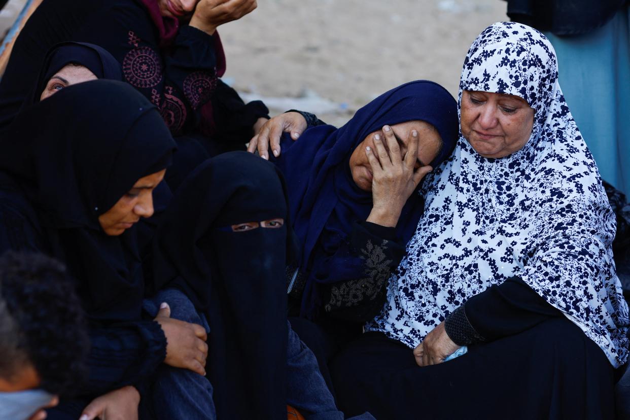 Mourners react during the funeral of Palestinians killed in Israeli strikes, amid the Israel-Hamas conflict, at Nasser hospital, in Khan Younis, southern Gaza Strip 26 August 2024 (Reuters)