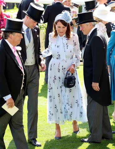 <p>Chris Jackson/Getty</p> Prince William chats with Carole and Michael Middleton at Royal Ascot on June 19, 2024