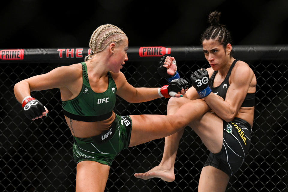 Jul 22, 2023; London, UNITED KINGDOM; Shauna Bannon (red gloves) fights Bruna Brasil (blue gloves) during UFC Fight Night at O2 Arena. Mandatory Credit: Per Haljestam-USA TODAY Sports