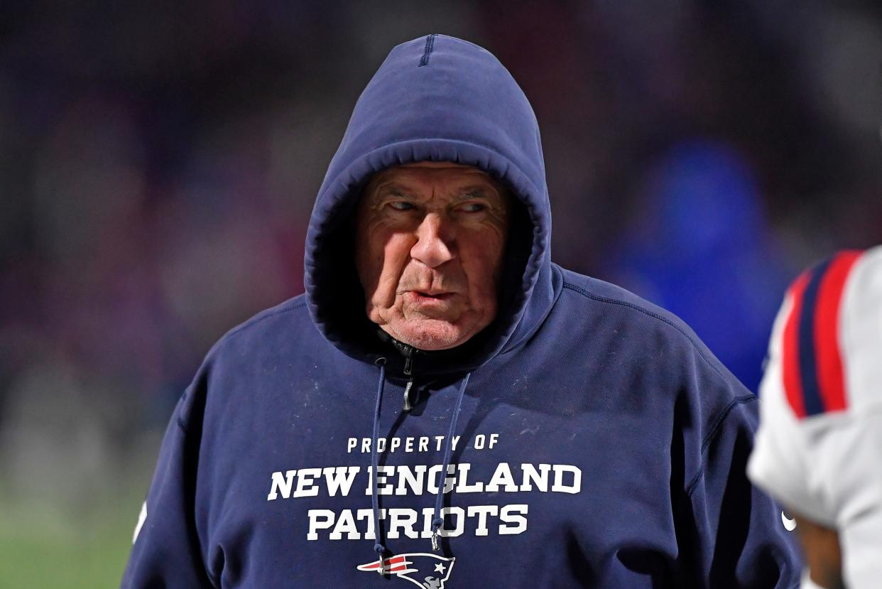 New England Patriots head coach Bill Belichick walks the sideline during the first half of an NFL football game against the Buffalo Bills in Orchard Park, N.Y., Monday, Dec. 6, 2021. (AP Photo/Adrian Kraus) ORG XMIT: NYGP126