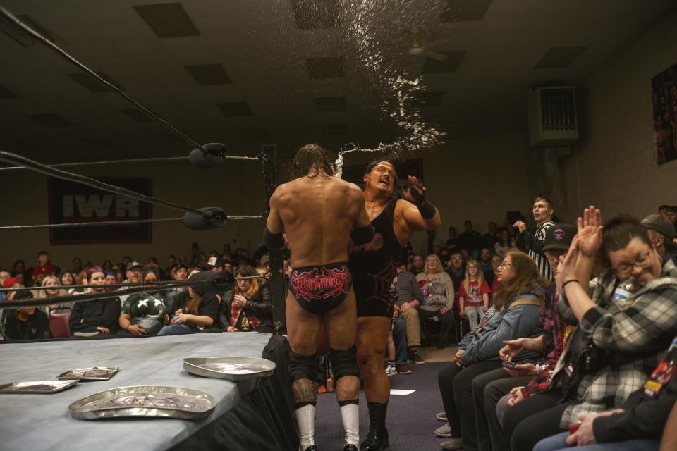 At IWR 26-Armageddon, The Manbeast Rhino hits former IWR World Heavyweight Champion King Latimer with a water bottle during their match while trash can lids and cookie sheets littered the ring.