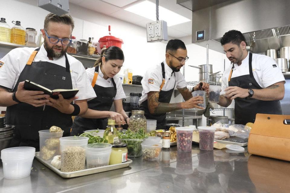 "Top Chef: Wisconsin" contestants Dan (from left), Laura, Danny and Manny prep their indigenous ingredients for the Episode 9 Elimination Challenge set at Milwaukee's Il Cervo restaurant.