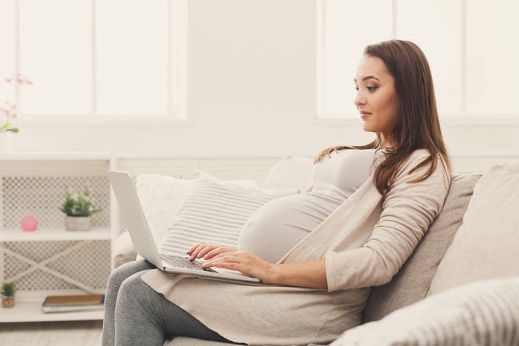 <span class="caption">Some consultations will move online.</span> <span class="attribution"><a class="link " href="https://www.shutterstock.com/image-photo/pregnant-woman-using-laptop-sitting-on-1030504219" rel="nofollow noopener" target="_blank" data-ylk="slk:Prostock-studio/Shutterstock;elm:context_link;itc:0;sec:content-canvas">Prostock-studio/Shutterstock</a></span>