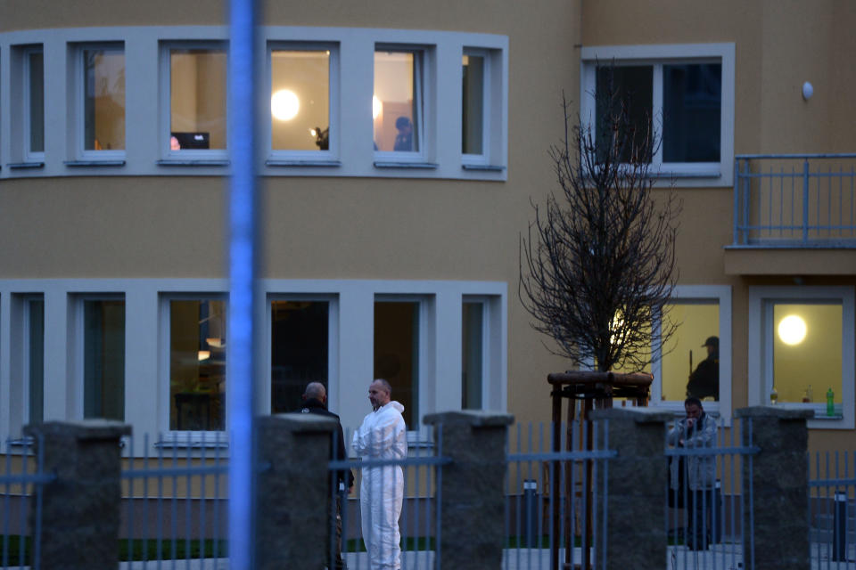 Investigators observe the situation in the residence of Palestinian ambassador to the Czech Republic Jamal Al Jamal, who has died after an explosion in his diplomatic flat in Prague-Suchdol on Wednesday, Jan. 1, 2014. (AP Photo/CTK, Katerina Sulova) SLOVAKIA OUT