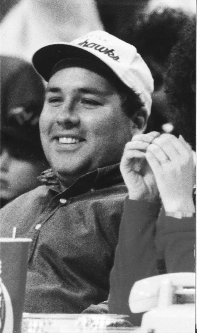 Deseret News sportswriter Dirk Facer grins while on press row.