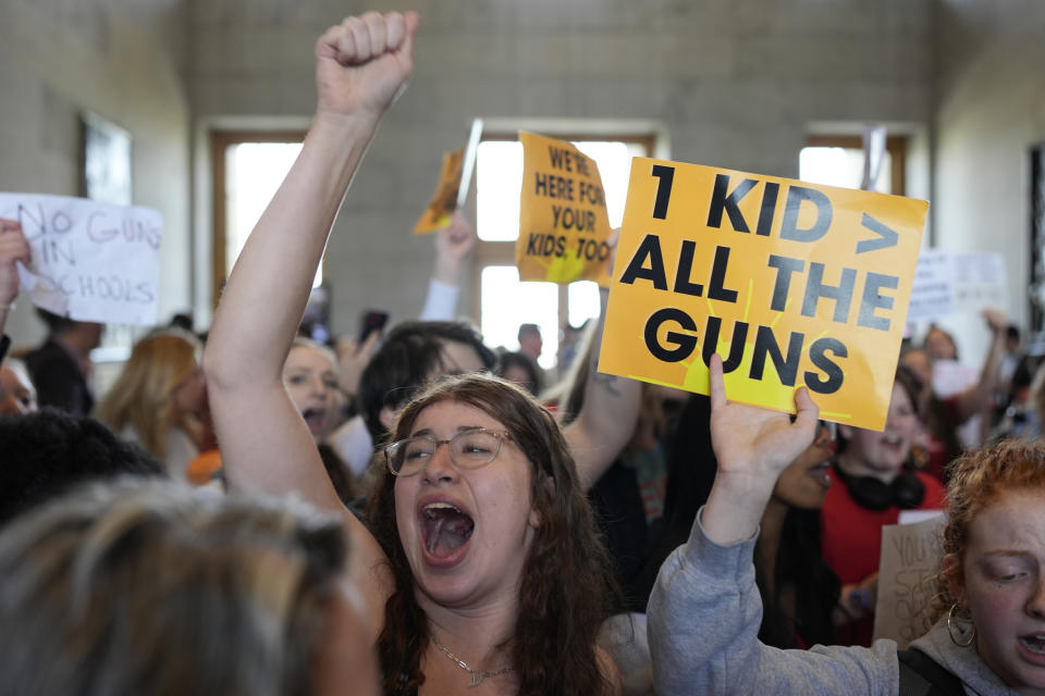 Emmie Wolf-Dubin, center, yells during a protest outside the House chamber after legislation passed that would allow some teachers to be armed in schools during a legislative session Tuesday, April 23, 2024, in Nashville, Tenn. (AP Photo/George Walker IV)