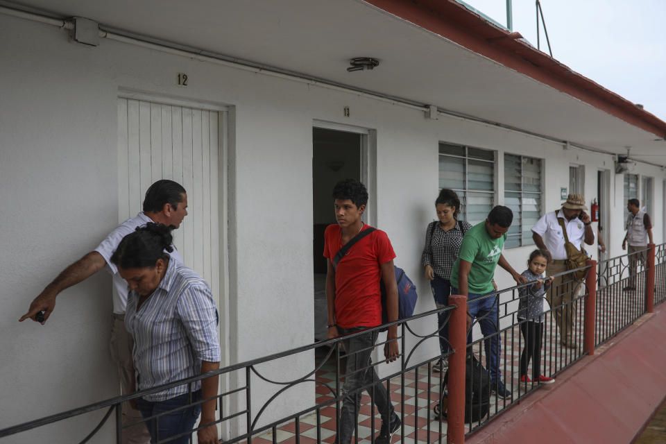 Central American migrants are detained during a raid by Mexican immigration agents at the Azteca Hotel in Veracruz, Mexico, Thursday, June 27, 2019. Under increasing U.S. pressure to reduce the flow of hundreds of thousands of Central Americans through Mexican territory, Mexico's government has stepped up enforcement. (AP Photo/Felix Marquez)