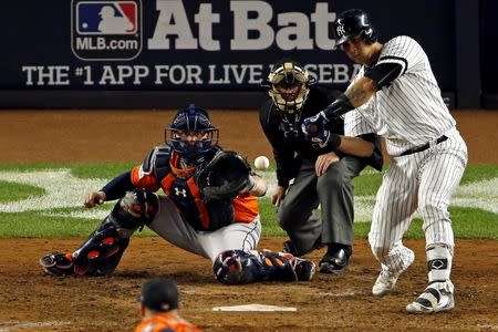 New York Yankees catcher Gary Sanchez (24) hits a home run during the seventh inning against the Houston Astros in game five of the 2017 ALCS playoff baseball series at Yankee Stadium, Bronx, NY, USA, October 18, 2017. Mandatory Credit: Adam Hunger-USA TODAY Sports