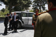 Secretary of State Mike Pompeo, center, is greeted as he arrives at the Presidential Palace in Kabul, Afghanistan, Tuesday, June 25, 2019, during an unannounced visit. (AP Photo/Jacquelyn Martin, Pool)