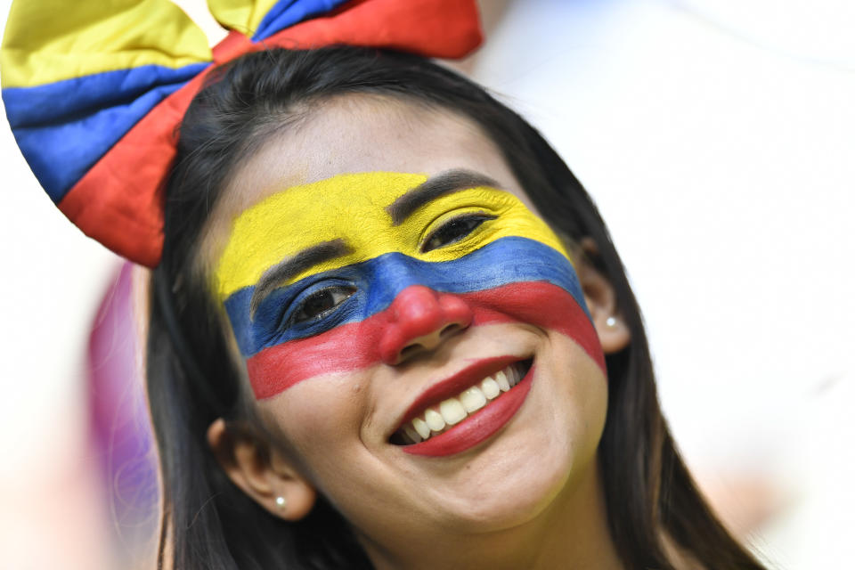 <p>A Colombian fan waits for the start of the group H match </p>
