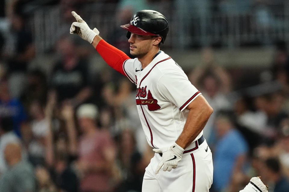 Atlanta Braves' Matt Olson gestures as he runs the bases after hitting a two-run home run during the fourth inning of the team's baseball game against the New York Mets on Tuesday, Aug. 16, 2022, in Atlanta. (AP Photo/John Bazemore)