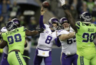 Minnesota Vikings quarterback Kirk Cousins (8) passes against the Seattle Seahawks in the first half of an NFL football game, Monday, Dec. 10, 2018, in Seattle. (AP Photo/Stephen Brashear)