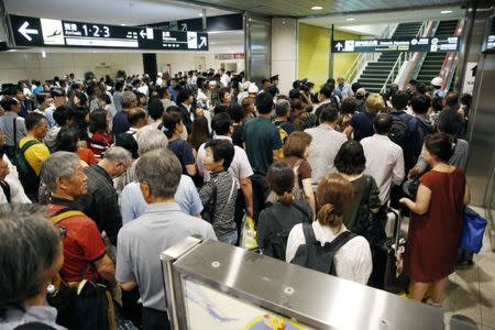 People crowd the New Chitose Airport after the restart of flights were announced, after the area was damaged by an earthquake, in Chitose, Hokkaido, northern Japan, in this photo taken by Kyodo September 7, 2018. Mandatory credit Kyodo/via REUTERS