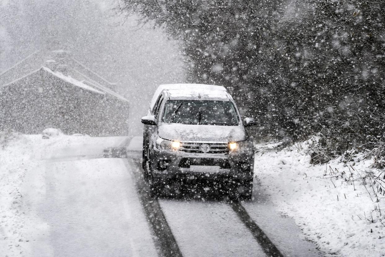 It is illegal to drive with a windscreen covered in snow and ice (Danny Lawson/PA) (PA Archive)