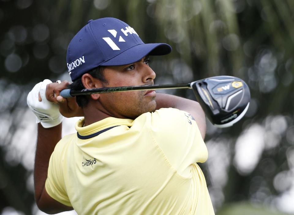 Anirban Lahiri, of India watches his shot after teeing off on the third tee during the third round of the Honda Classic golf tournament, Saturday, Feb. 25, 2017, in Palm Beach Gardens, Fla. (AP Photo/Wilfredo Lee)