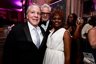 Gene Sperling, Bradley Whitford, and Karine Jean-Pierre at the CBS News White House Correspondents\’ Dinner after party