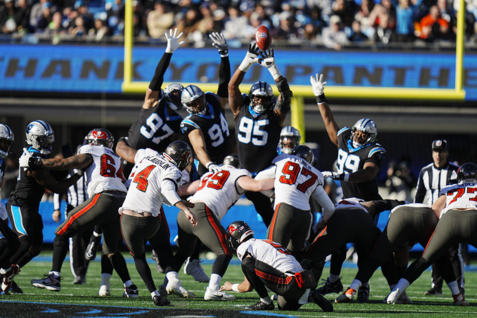 Tampa Bay Buccaneers' Chase McLaughlin (4) kicks a 57-yard field goal against the Carolina Panthers during the first half of an NFL football game, Sunday, Jan. 7, 2024, in Charlotte, N.C. (AP Photo/Rusty Jones)