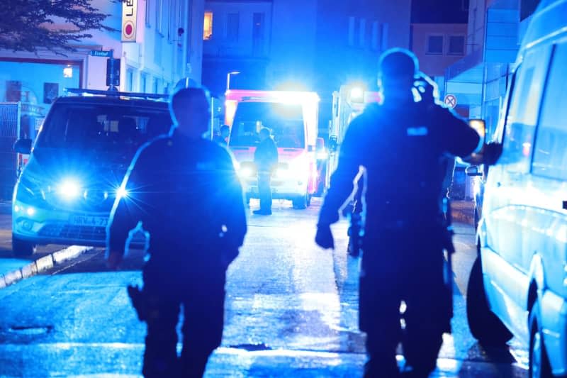 Police and ambulances stand near the scene, where people were killed and injured in an attack at the 650th anniversary celebrations of the city of Solingen in western Germany Gianni Gattus/dpa