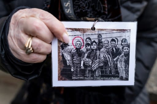 Holocaust survivor and former prisoner of the Nazi death camp Auschwitz-Birkenau, Miriam Ziegler (Friedman), shows a picture of her and other prisoners just after the camp was liberated