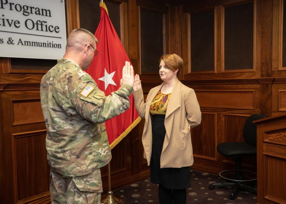 Picatinny Arsenal Senior Commander, Brig. Gen. John T. Reim, administers the oath of enlistment to Sarah Worthy during her enlistment ceremony on Dec. 22, 2022.