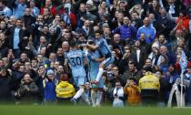 Britain Football Soccer - Manchester City v Chelsea - Premier League - Etihad Stadium - 3/12/16 Manchester City's Jesus Navas celebrates with Sergio Aguero and Nicolas Otamendi after Gary Cahill scored an own goal and their first Reuters / Phil Noble Livepic EDITORIAL USE ONLY. No use with unauthorized audio, video, data, fixture lists, club/league logos or "live" services. Online in-match use limited to 45 images, no video emulation. No use in betting, games or single club/league/player publications. Please contact your account representative for further details.