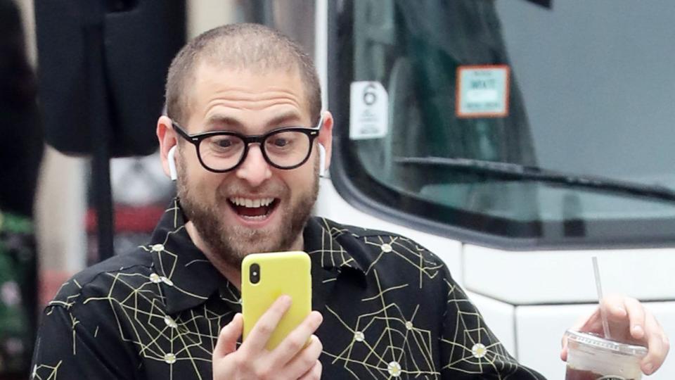 <p>Jonah Hill looks totally pumped to have a handle on this iced coffee, but we think about this photo of him <a href="https://people.com/movies/jonah-hill-responds-to-meme-about-him-dropping-his-coffee/#:~:text=Never%2520Forget%2520You'-,Jonah%2520Hill%2520Responds%2520to%2520Meme%2520About%2520Him%2520Dropping%2520His%2520Coffee,I'll%2520Never%2520Forget%2520You'&text=The%2520actor%2520inadvertently%2520became%2520a,cool%252C%2520calm%252C%2520and%2520collected." rel="nofollow noopener" target="_blank" data-ylk="slk:dropping another, less secure iced coffee;elm:context_link;itc:0;sec:content-canvas" class="link ">dropping another, less secure iced coffee</a> a latte, too. </p>