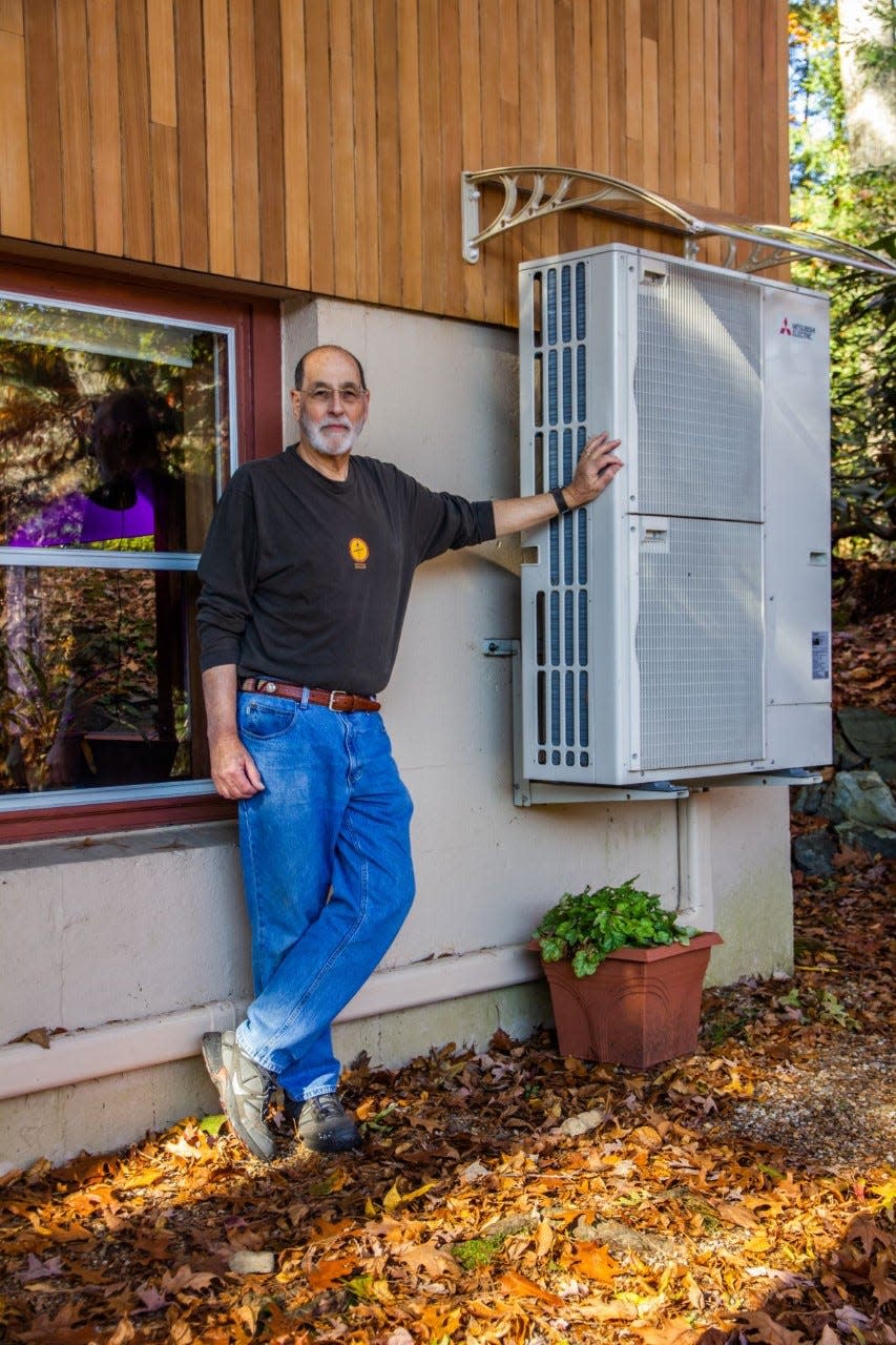 Geoff Tritsch, a Concord, Massachusetts resident, made the switch to an electric heat pump for his 1,800-square-foot home. The highly-energy efficient technology transfers heat into or out of the house, cooling it in summer and warming it in winter. If signed into law, the Inflation Reduction Act would offer financial incentives for homeowners to install heat pumps and other efficient technologies.