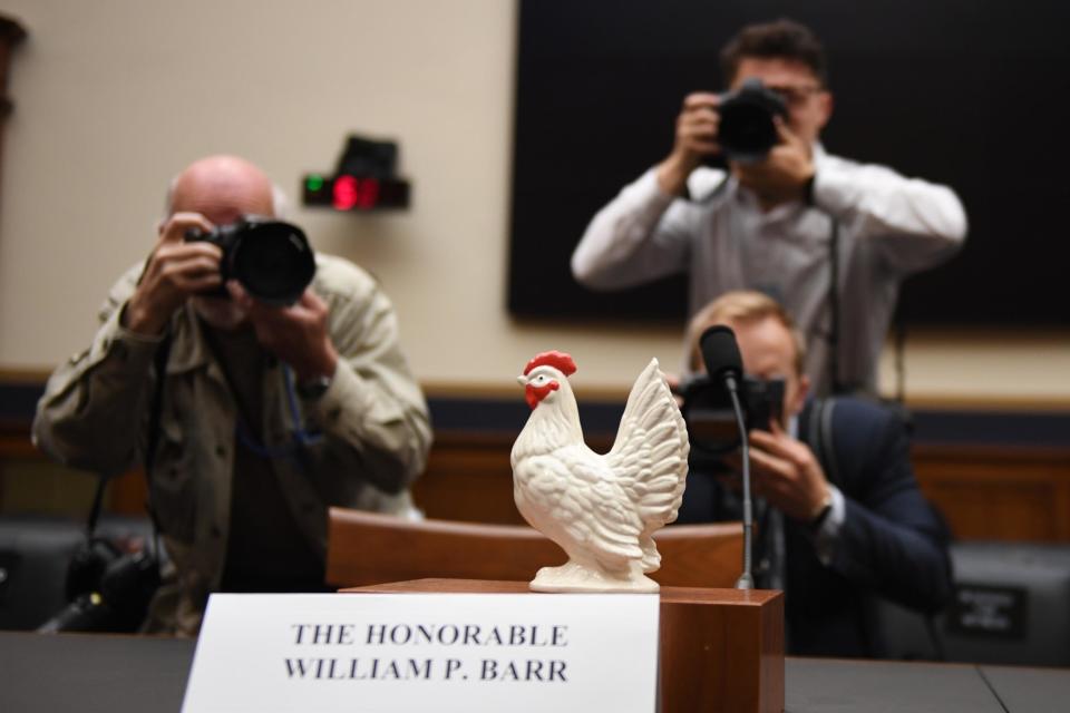 A US congressman bizarrely brought a bucket of fried chicken to the House Judiciary Committee hearing that Attorney General William Barr refused to attend Thursday morning.Seemingly a shot at Mr Barr’s fear of the committee, Rep. Steve Cohen, the Democratic representative from Tennessee, also brought in a ceramic chicken.He placed the chicken in what would have been the Attorney General's spot before the committee.He told reporters “He’s here!” and gestured to his bucket of fried chicken. He then proceeded to eat from the bucket, and offer its contents to his colleagues.Perhaps because the chicken was presented well before noon, none took him up on the offer. Mr Barr hinted late Wednesday night that he would not be attending the House Judiciary Committee hearing to review special counsel Robert Mueller's report on Thursday, after a long day of being questioned by the Senate Judiciary Committee. On Thursday, he did not show up to the hearing.Today’s hearing would have allowed lawyers from both political sides to question the attorney general after the traditional round from members of Congress.The Justice Department expressed its disapproval over this format, which has been used in notable situations in the past.Members of congress have responded by using their time to express their disapproval of Mr Barr’s failure to appear. In Rep. Cohen’s case, his opinion of the nature of Mr Barr’s lack of appearance is clear.