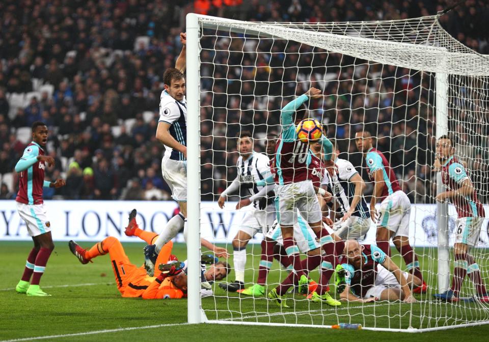 <p>West Brom defender Gareth McAuley deflects home a 94th minute equaliser in their 2-2 draw at West Ham </p>