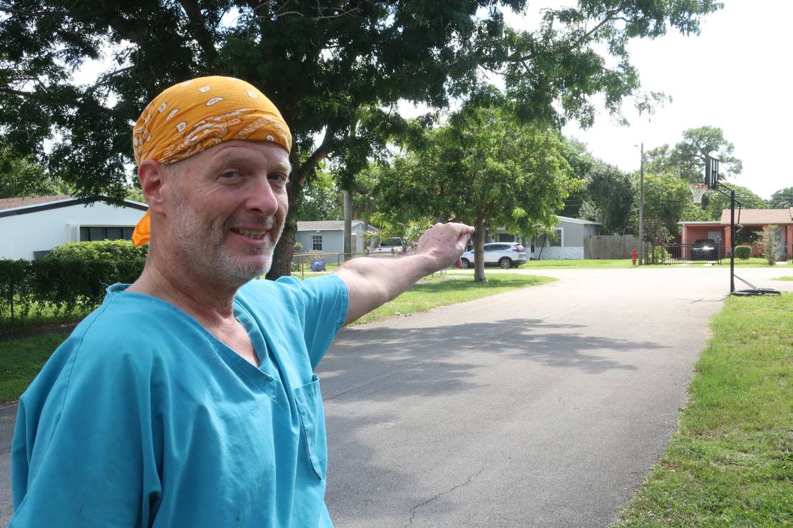 The second inspection report issued by Sutton Inspection Bureau said there was no fire hydrant within 1,000 feet. Robert Mitchell points to a red hydrant two doors down from his Fort Lauderdale home.