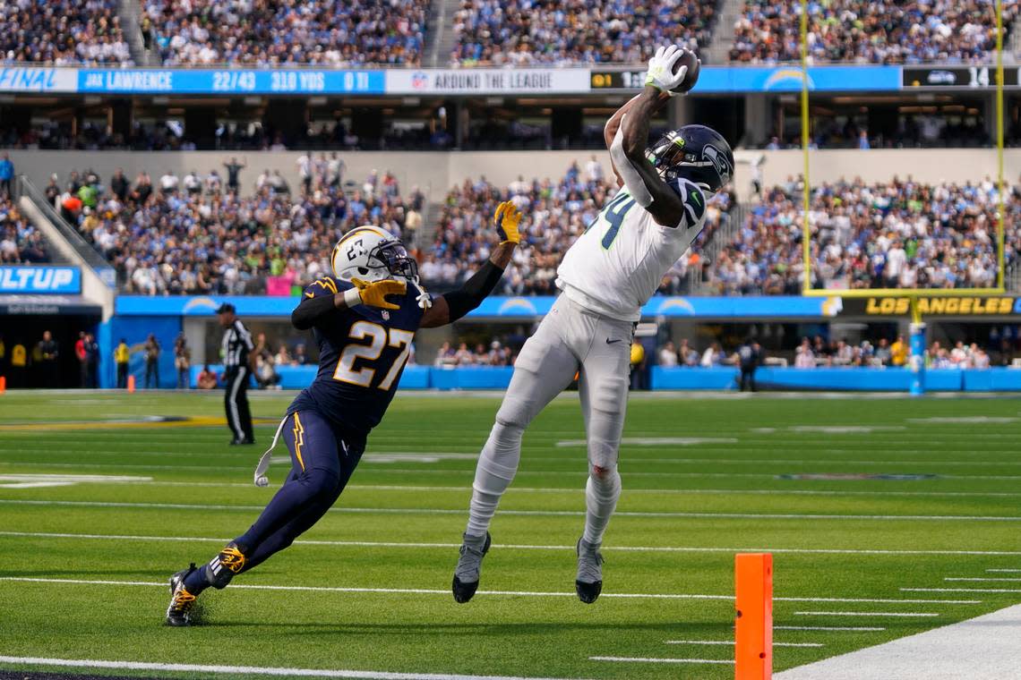 Seattle Seahawks wide receiver DK Metcalf (14) reaches for an incomplete pass against Los Angeles Chargers cornerback J.C. Jackson (27) during the first half of an NFL football game Sunday, Oct. 23, 2022, in Inglewood, Calif. (AP Photo/Mark J. Terrill) Mark J. Terrill/AP