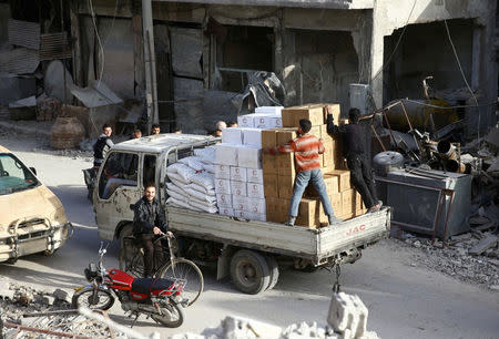 A pick-up truck loaded with humanitarian aid arrives at the besieged town of Douma, Eastern Ghouta, Damascus, Syria March 5, 2018. REUTERS/Bassam Khabieh