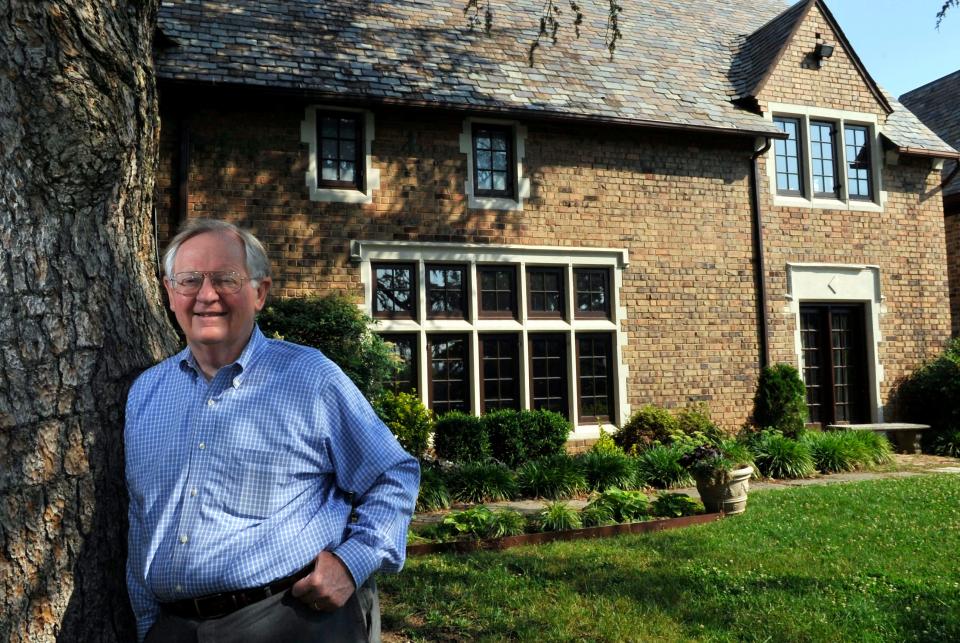 Former ambassador and Knoxville mayor Victor Ashe stands in front of his boyhood home at 1811 Melrose Ave. in 2002.