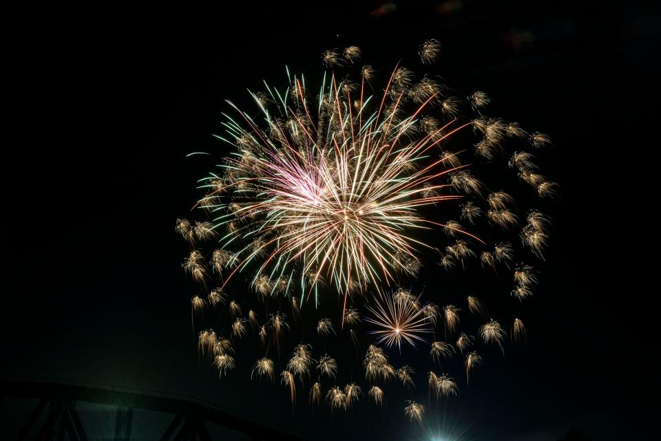 Fireworks light up the sky during the Independence Day Celebration held along the Ohio Riverfront in Downtown Henderson, Ky., Saturday night, July 3, 2021.