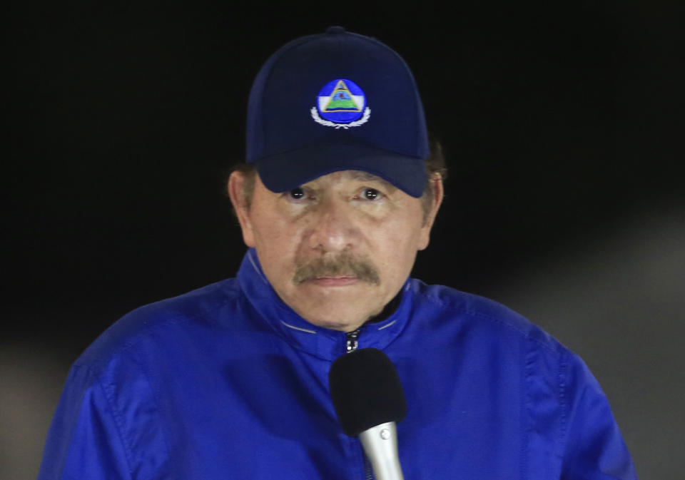 FILE - Nicaragua's President Daniel Ortega speaks during the inauguration ceremony of a highway overpass in Managua, Nicaragua, March 21, 2019. Exiled Nicaraguan economist Javier Álvarez received terrible news this first week of Oct. 2022: his wife, daughter and son-in-law, jailed three weeks ago by the government of President Daniel Ortega, have been formally charged with serious crimes back in Nicaragua. (AP Photo/Alfredo Zuniga, File)