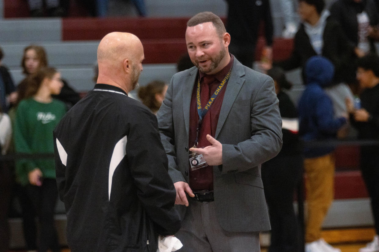 Stroudsburg High School's head wrestling coach Sean Richmond talks to an official after the match against Pocono Mountain West on Dec. 7, 2023.