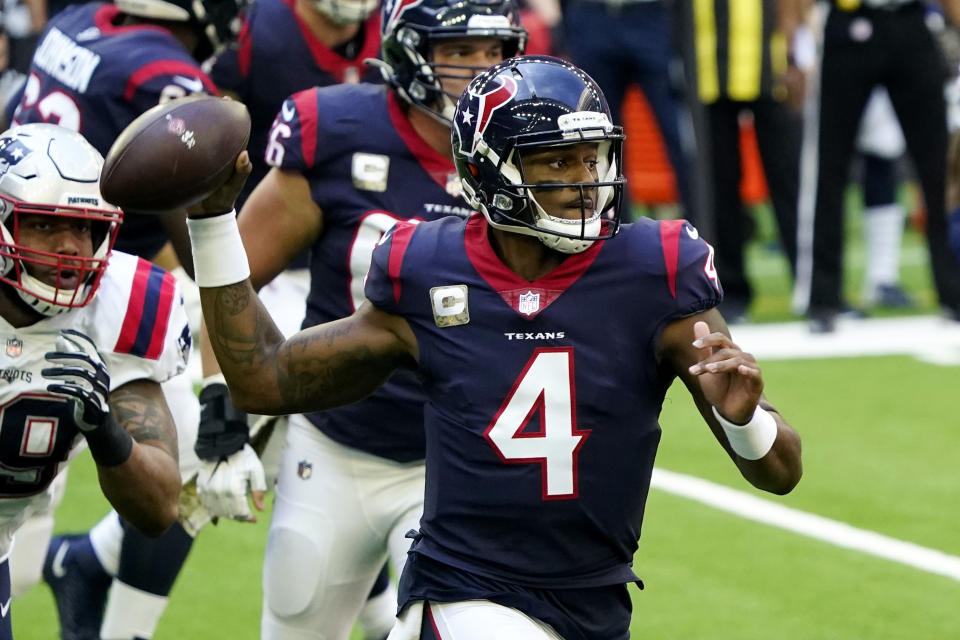 Houston Texans quarterback Deshaun Watson (4) looks to throw against the New England Patriots during the first half of an NFL football game, Sunday, Nov. 22, 2020, in Houston. (AP Photo/David J. Phillip)