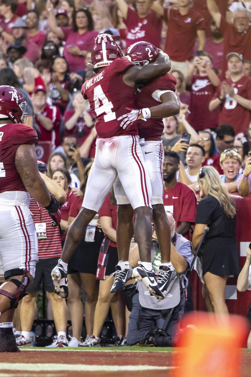 Alabama quarterback Jalen Milroe (4) hugs running back Jase McClellan (2) after McClellan scored a touchdown against Middle Tennessee during the first half an NCAA college football game Saturday, Sept. 2, 2023, in Tuscaloosa, Ala. (AP Photo/Vasha Hunt)