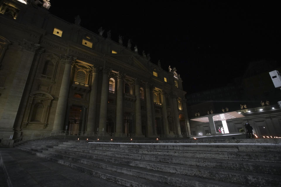 Pope Francis leads the Via Crucis – or Way of the Cross – ceremony in front of St. Peter's Basilica, empty of the faithful following Italy's ban on gatherings during a national lockdown to contain contagion, at the Vatican, Friday, April 10, 2020. (AP Photo/Andrew Medichini, Pool)